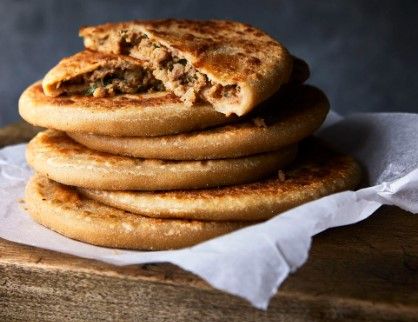 A stack of keema parathas stuffed with spiced minced meat